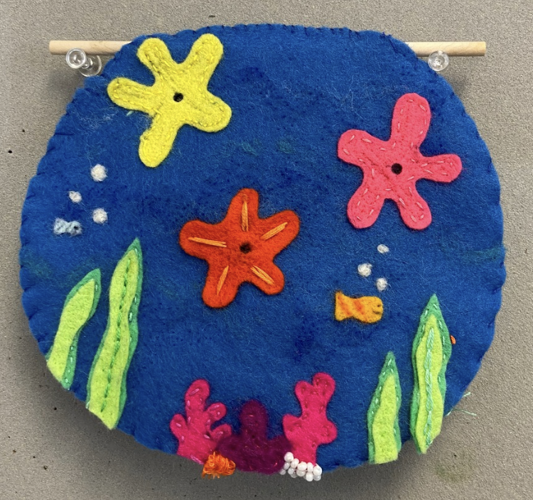 Embroidery sampler with LEDs on felt